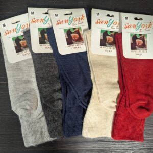 A collection of alpaca fleece socks in various colors.