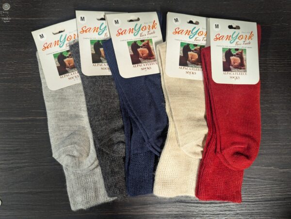 A collection of alpaca fleece socks in various colors.